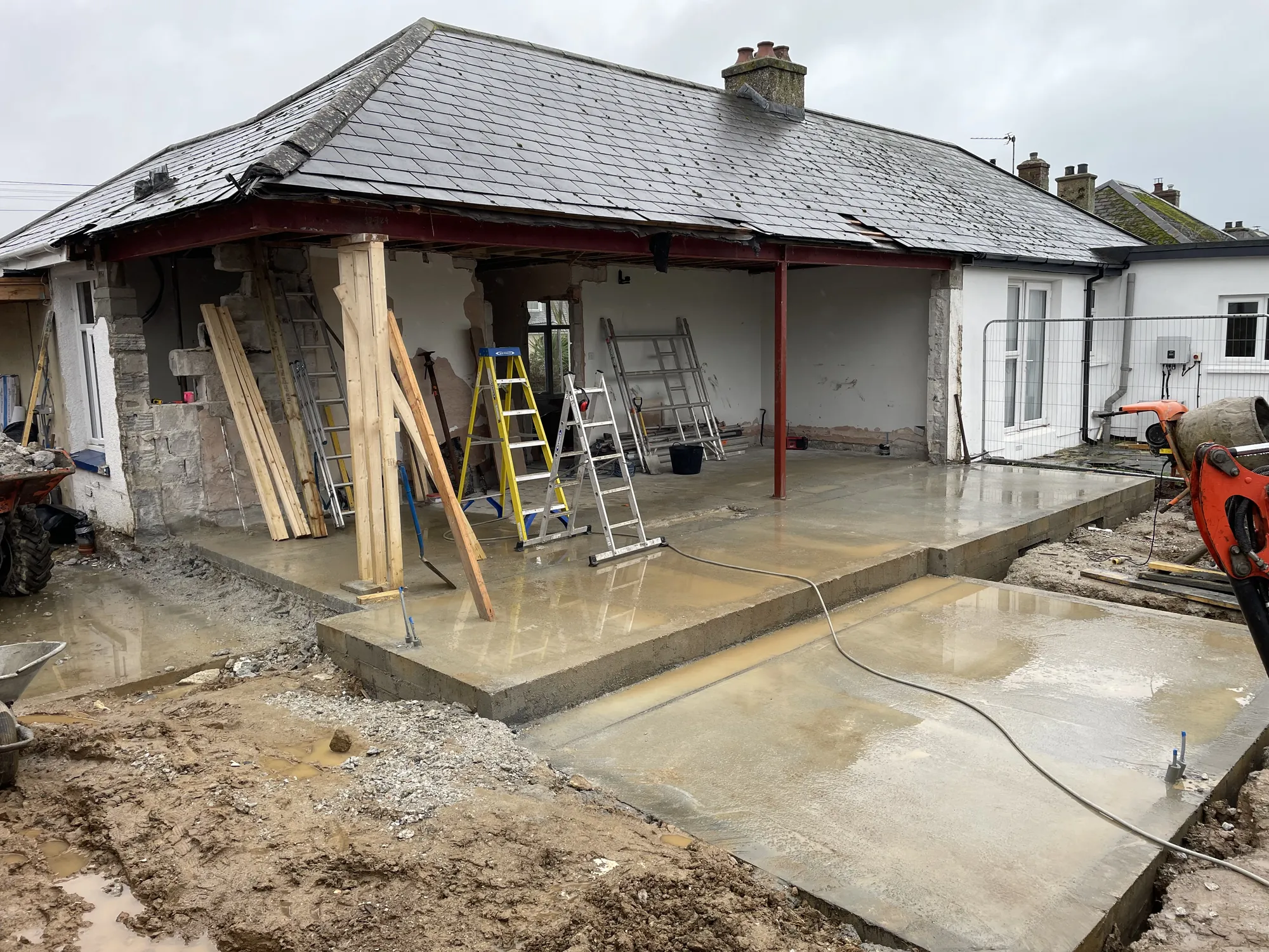 Cornwall bungalow extension under construction with structural steelwork and temporary timber supports