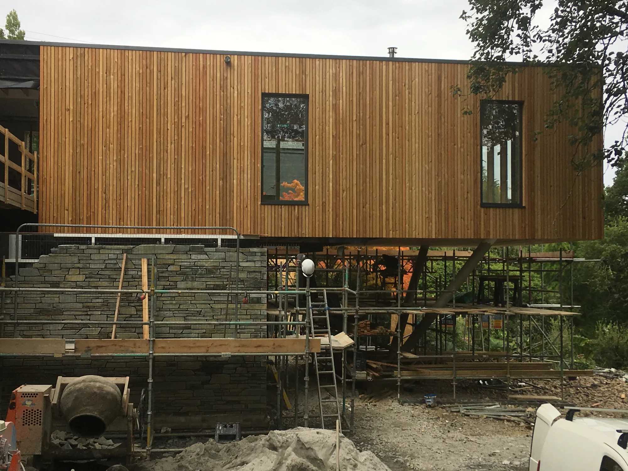 Timber cladding, stonework and building-envelope construction at Sylvania in Feock, Cornwall